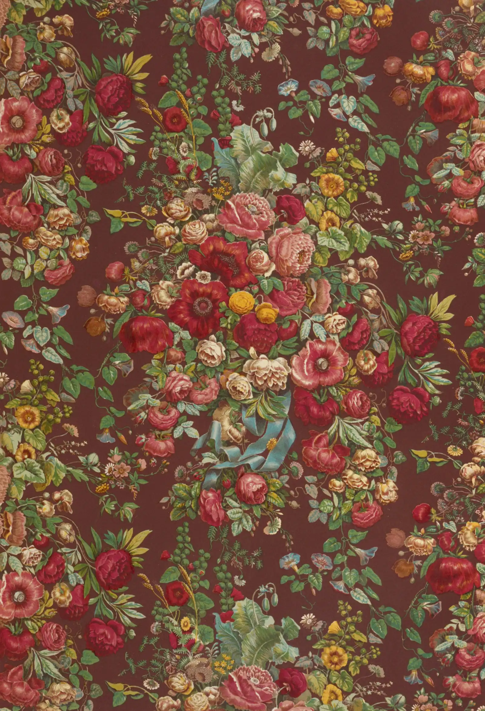 A dense historic floral textile design of red and pink roses with green leaves on a dark brown ground