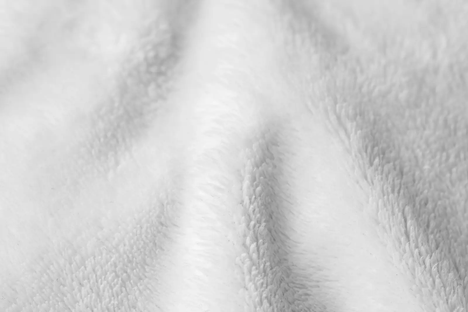 Close-up of soft white brushed flannel fabric with a gentle, fuzzy surface